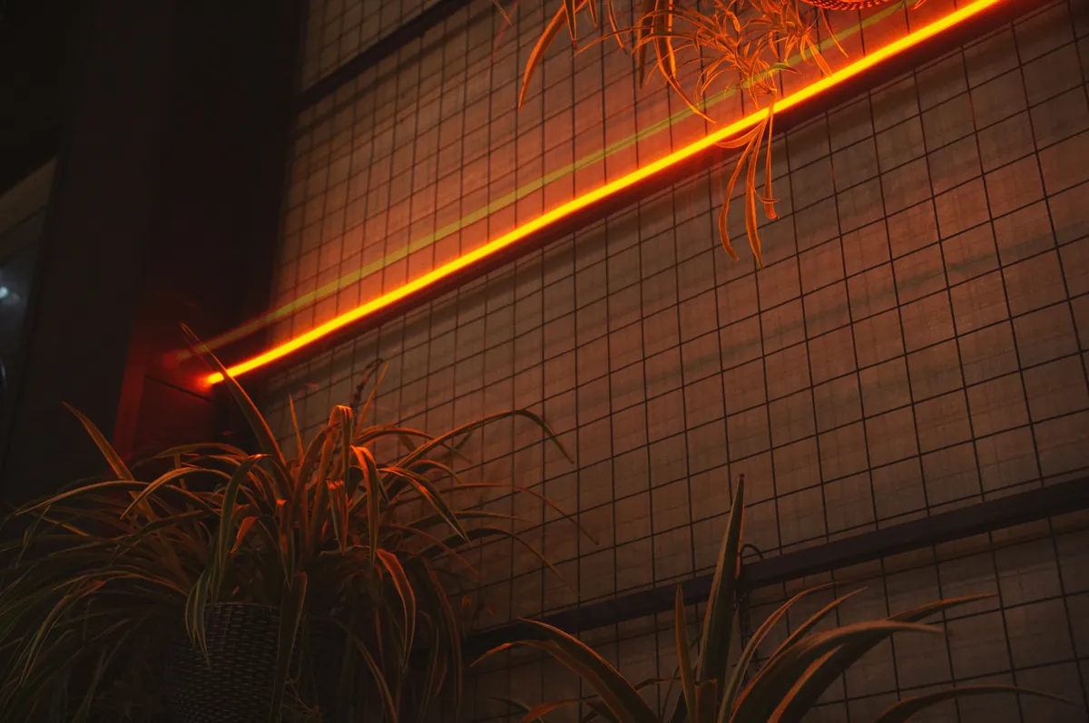 Architectural lighting and orange interior accent